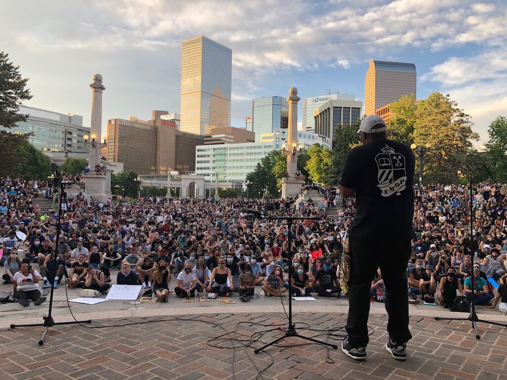 Pastor Rico Wint, founder of the metro Denver Young Men of Purpose, speaks to the crowd gathered Thursday, June 4, 2020 at Denver's Civic Center amphitheatre. (Photo by
